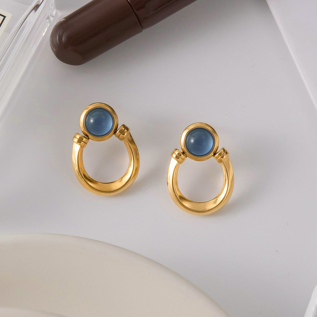 Blue resin stainless steel earrings with a touch of understated luxury.