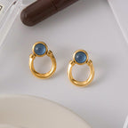 Blue resin stainless steel earrings with a touch of understated luxury.
