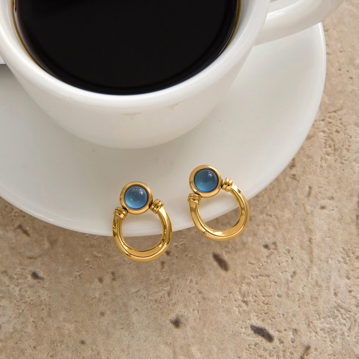 Blue resin stainless steel earrings with a touch of understated luxury.