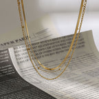 Three-layered stainless steel clavicle chain for a touch of understated luxury.