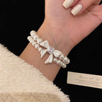 Double-layer pearl bow zircon copper alloy set