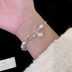 French Manta Rose Pearl Brooch Saturn Pull-Out Bracelet