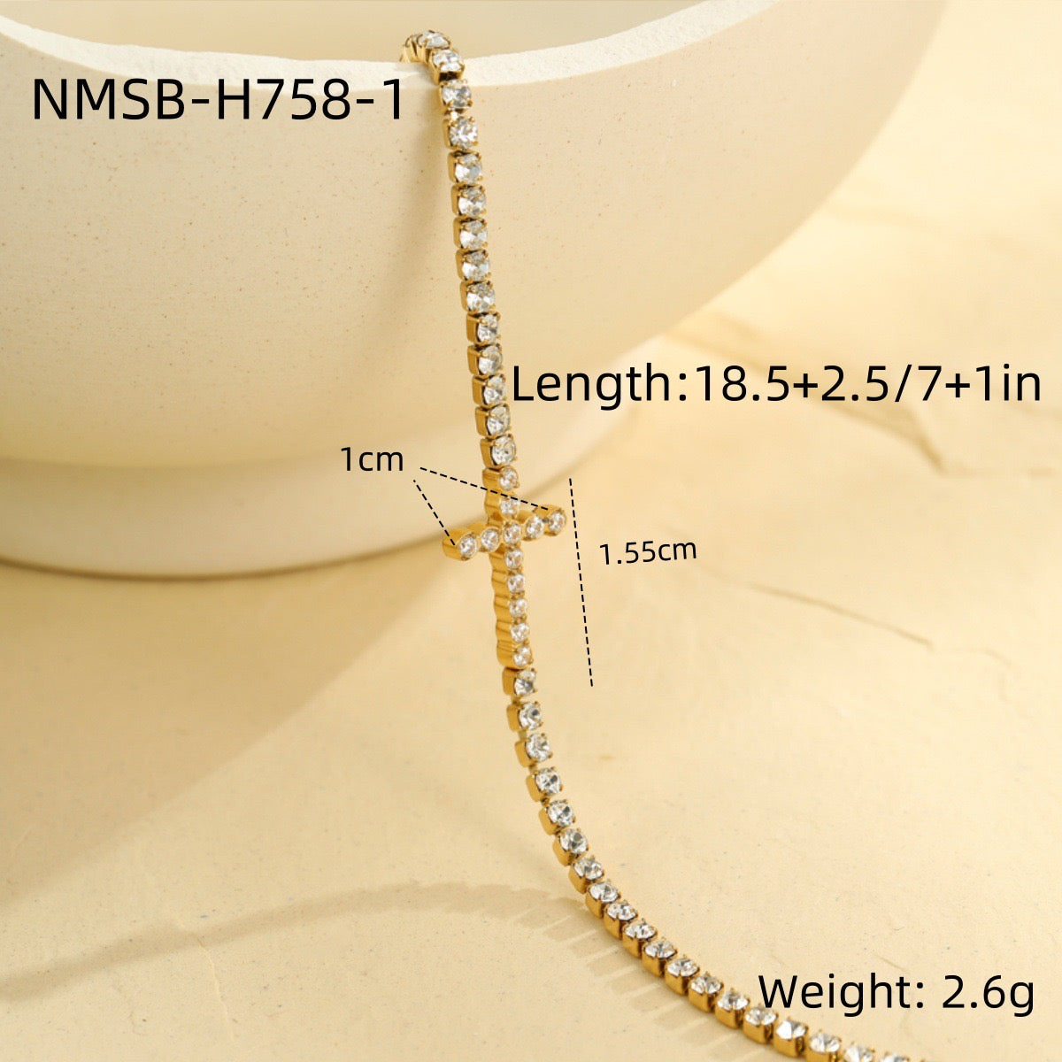 Cross-shaped diamond-encrusted stainless steel bracelet that won't fade.