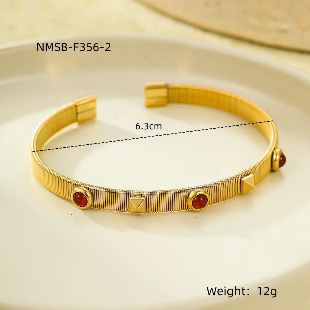French retro court style stainless steel bracelet with zircon inlay, adjustable opening, and colorfast.