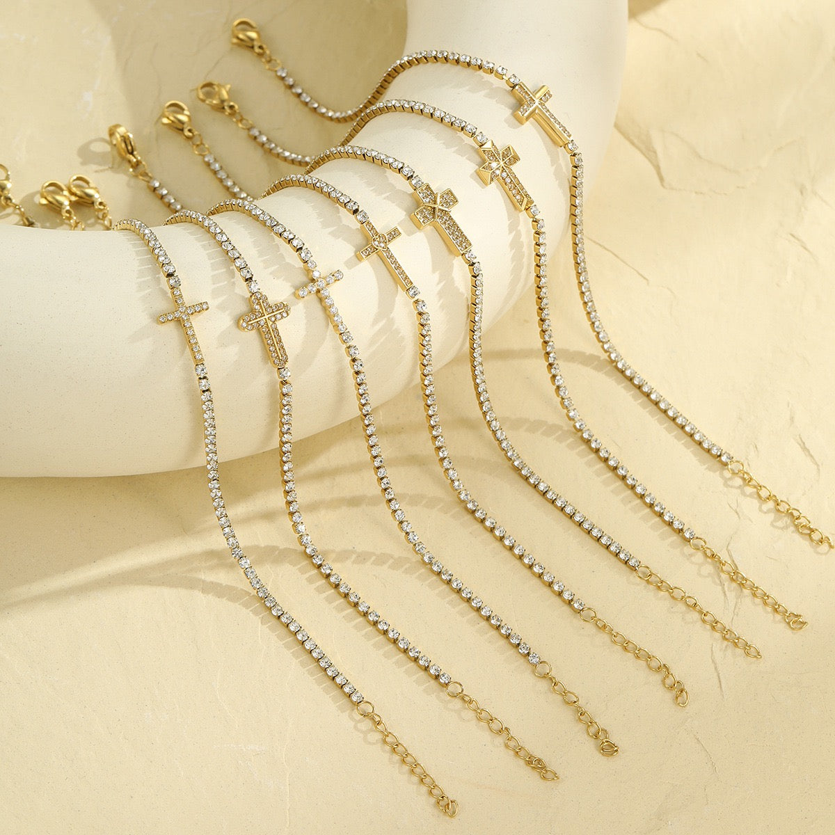 Cross-shaped diamond-encrusted stainless steel bracelet that won't fade.