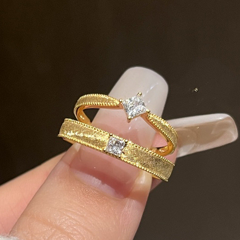 Vintage plain band brass alloy ring with single or square diamonds.