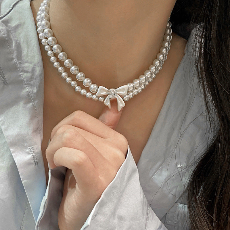 Double-layer pearl bow zircon copper alloy set