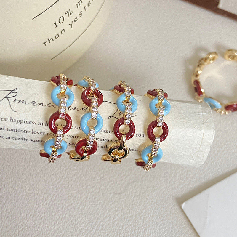 Vintage-style glazed zircon ring in copper alloy