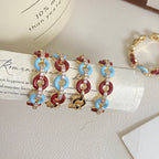 Vintage-style glazed zircon ring in copper alloy