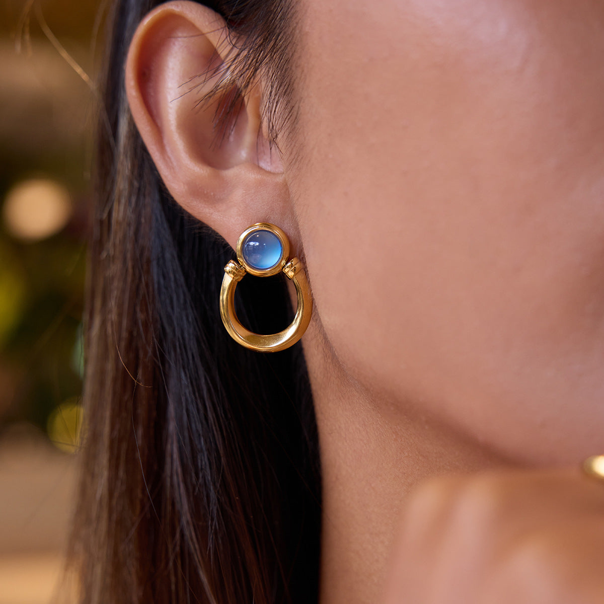 Blue resin stainless steel earrings with a touch of understated luxury.