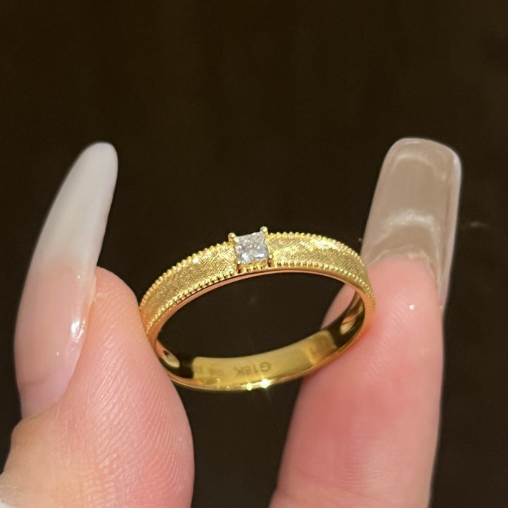 Vintage plain band brass alloy ring with single or square diamonds.