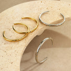 Stylish stainless steel bracelet with a striking five-pointed star design and diamond embellishments.