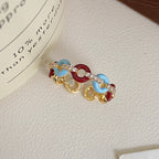 Vintage-style glazed zircon ring in copper alloy