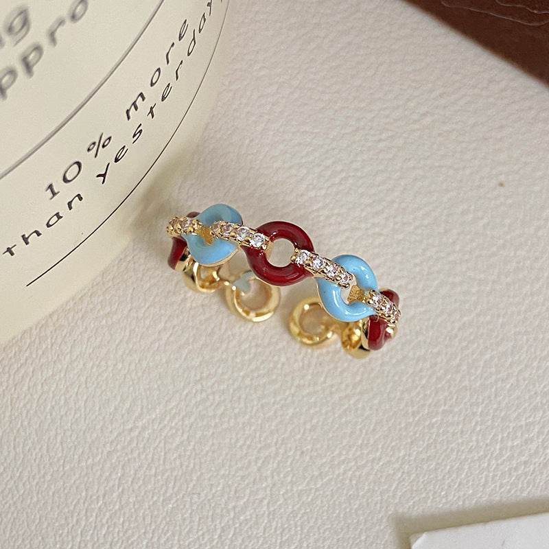 Vintage-style glazed zircon ring in copper alloy