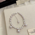 Manta Rose Pearl Necklace and Copper Alloy Bracelet