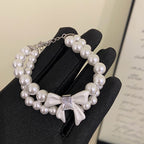 Double-layer pearl bow zircon copper alloy set