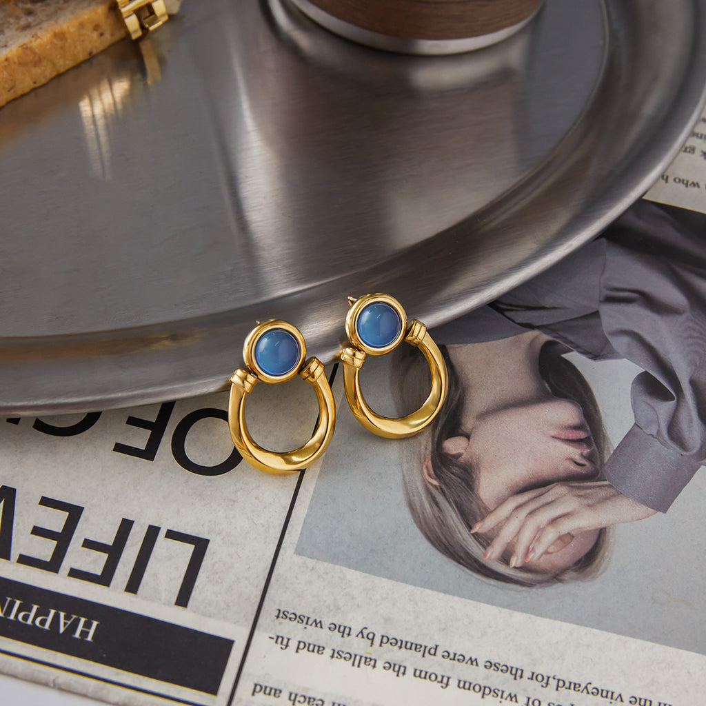 Blue resin stainless steel earrings with a touch of understated luxury.
