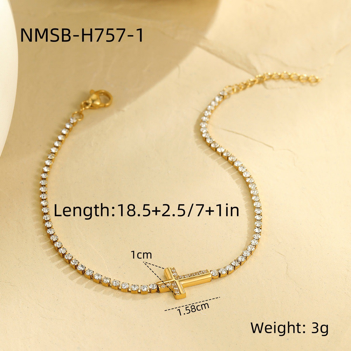 Cross-shaped diamond-encrusted stainless steel bracelet that won't fade.