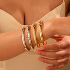 Stylish stainless steel bracelet with a striking five-pointed star design and diamond embellishments.