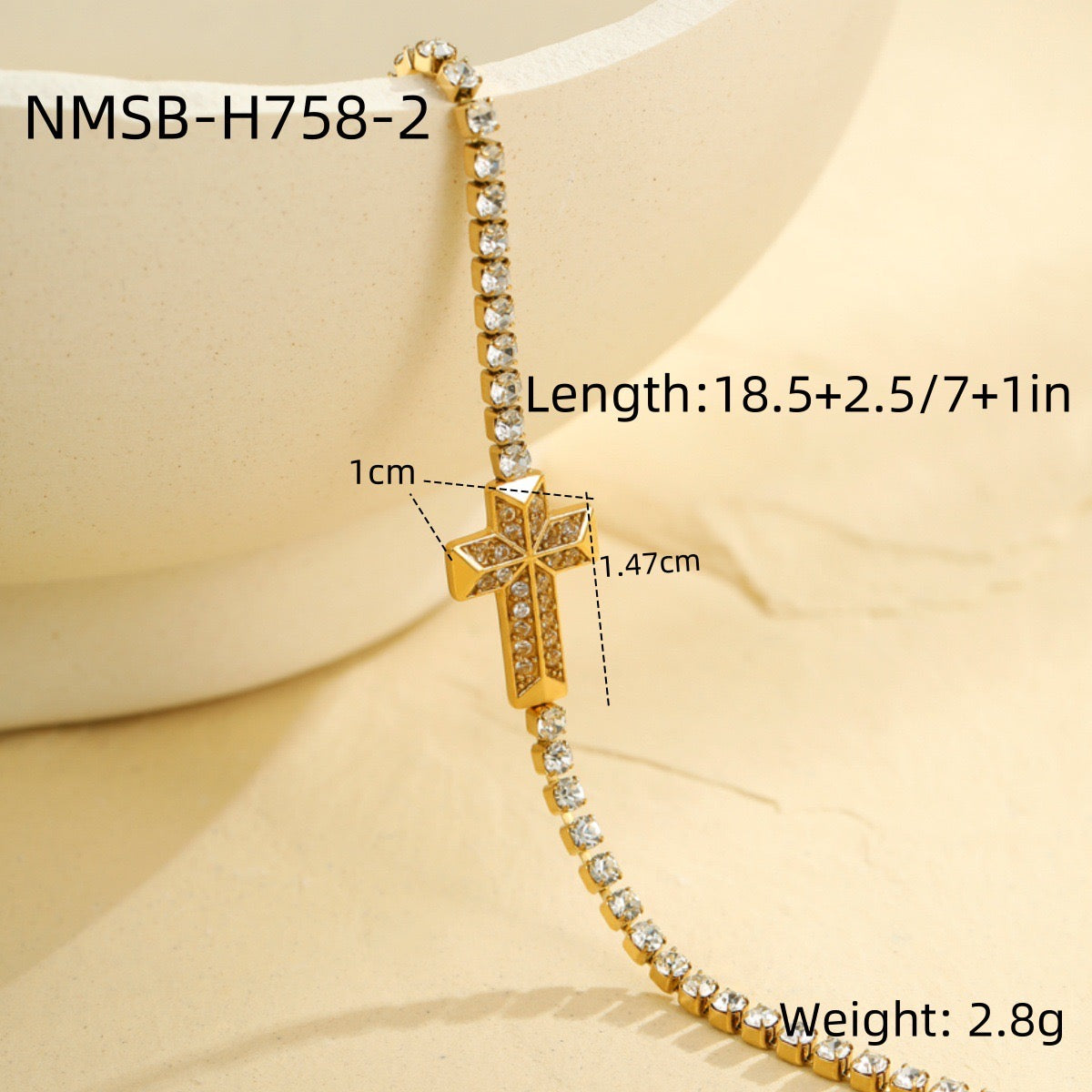 Cross-shaped diamond-encrusted stainless steel bracelet that won't fade.