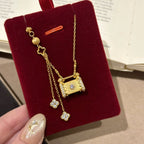 Fully rhinestone tassel brushed four-leaf clover lock case copper alloy necklace