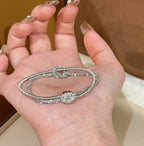 Gold wire bracelet with multiple strands of gold wire, stacked copper alloy bracelet