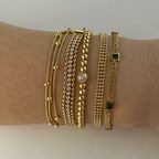 Stainless steel stacked bracelet with PVD-plated small gold beads and gold chain
