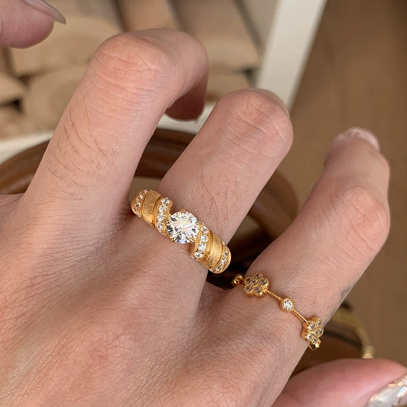 Five-flower rotating copper alloy diamond ring