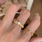 Five-flower rotating copper alloy diamond ring