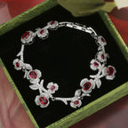 Red sapphire zircon inlaid with rose and camellia bracelet