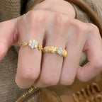 Five-flower rotating copper alloy diamond ring
