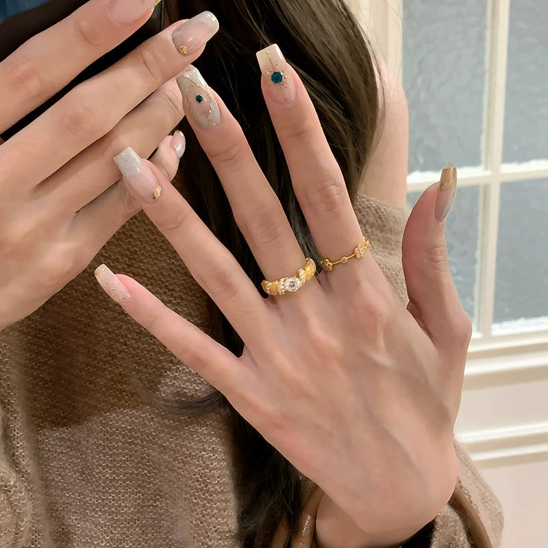 Five-flower rotating copper alloy diamond ring