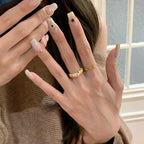 Five-flower rotating copper alloy diamond ring