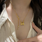 Fully rhinestone tassel brushed four-leaf clover lock case copper alloy necklace