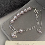 French Manta Rose Pearl Brooch Saturn Pull-Out Bracelet